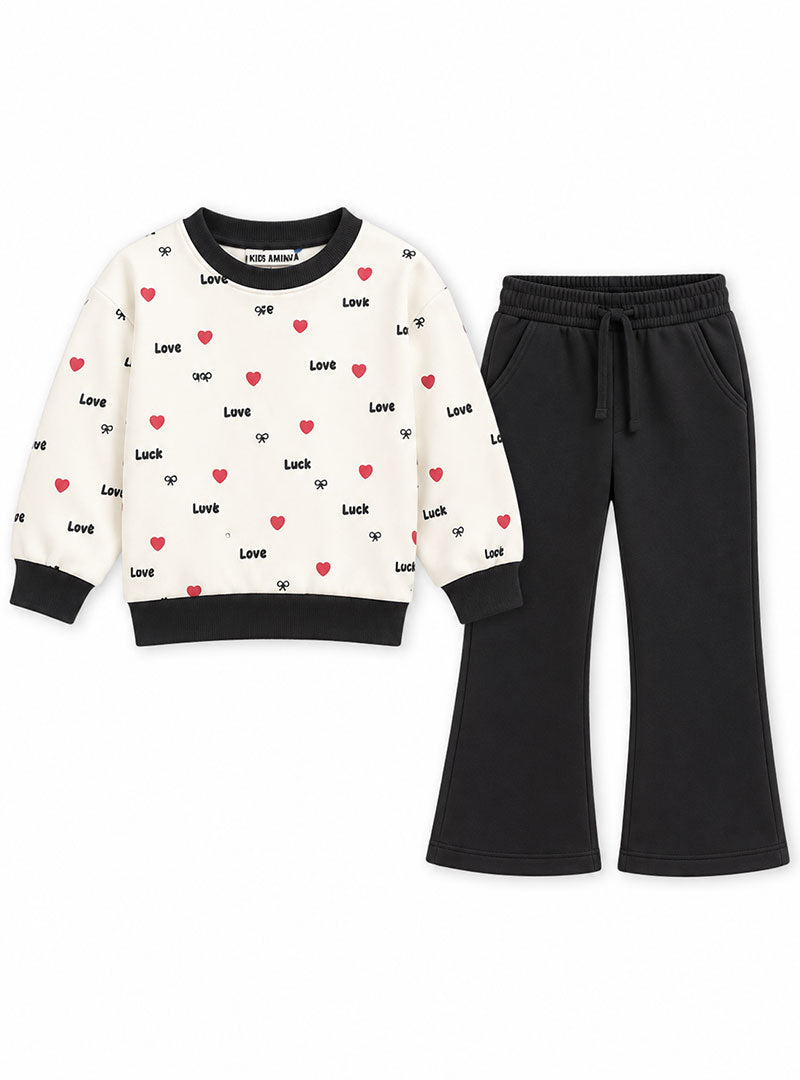 Girls cream heart print sweatshirt and black flared trouser set